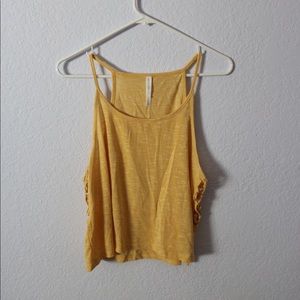 Light yellow tank top with cut outs